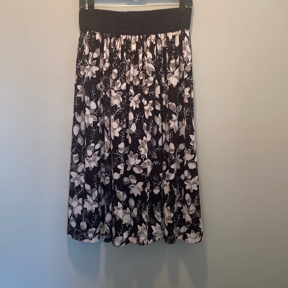 Chelsea Taylor Medium long tan, white and black skirt.